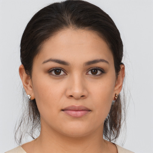 Joyful white young-adult female with medium  brown hair and brown eyes