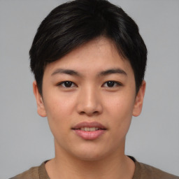 Joyful asian young-adult female with short  black hair and brown eyes