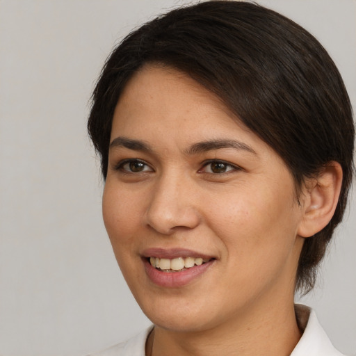 Joyful white young-adult female with medium  brown hair and brown eyes