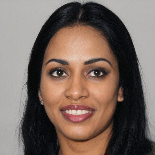 Joyful asian young-adult female with long  black hair and brown eyes