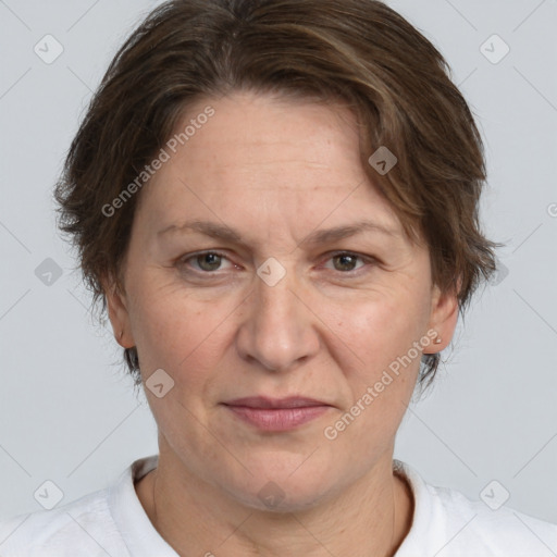 Joyful white adult female with medium  brown hair and brown eyes