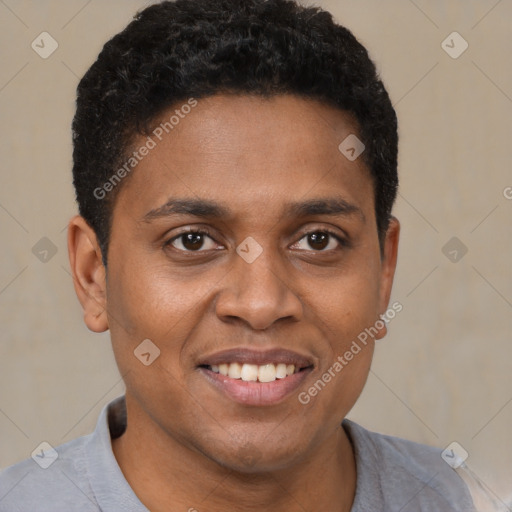 Joyful black young-adult male with short  brown hair and brown eyes