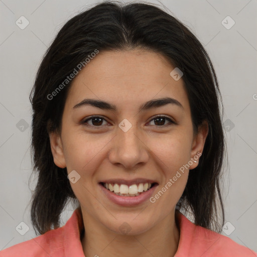 Joyful latino young-adult female with medium  brown hair and brown eyes