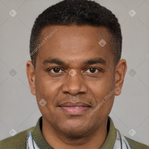 Joyful latino young-adult male with short  brown hair and brown eyes