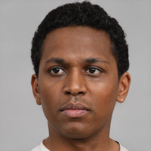 Neutral black young-adult male with short  black hair and brown eyes