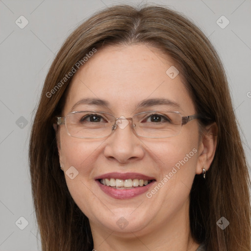 Joyful white adult female with long  brown hair and grey eyes