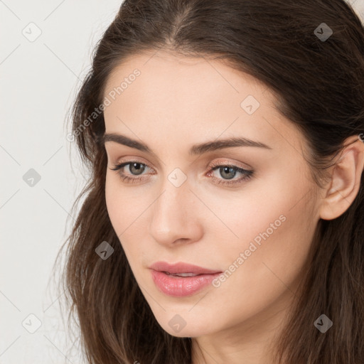 Neutral white young-adult female with long  brown hair and brown eyes