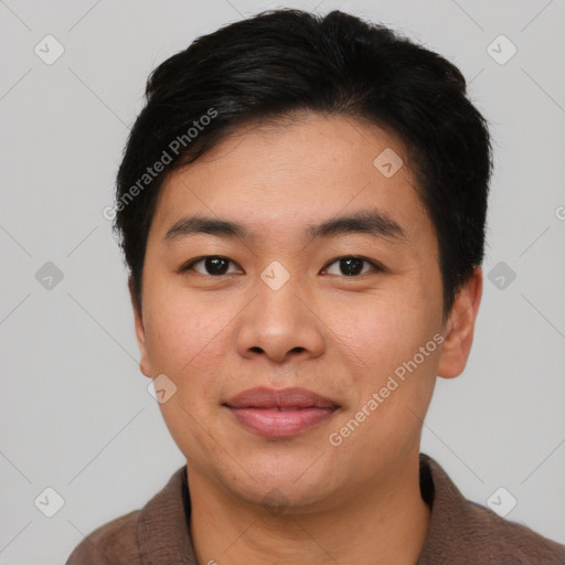 Joyful asian young-adult male with short  black hair and brown eyes