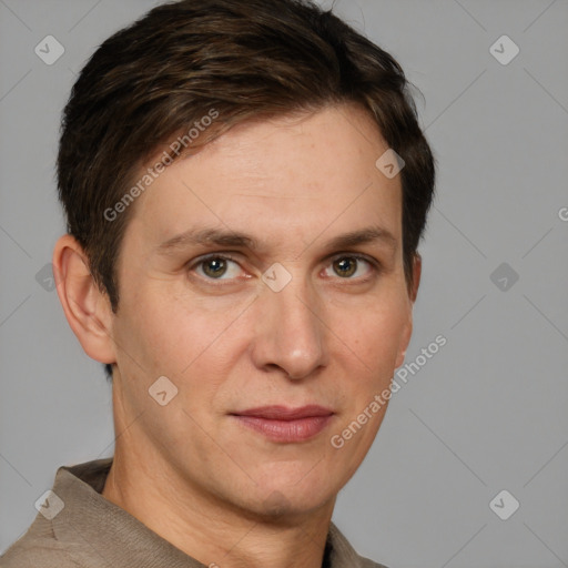 Joyful white adult male with short  brown hair and grey eyes