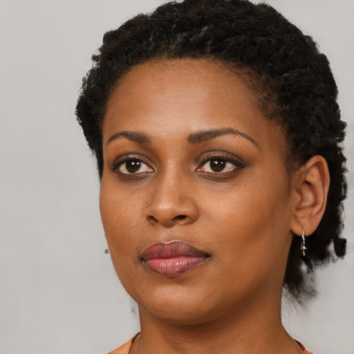 Neutral black young-adult female with short  black hair and brown eyes