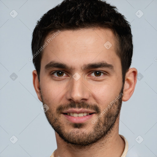 Joyful white young-adult male with short  brown hair and brown eyes