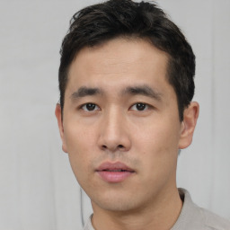 Neutral asian young-adult male with short  black hair and brown eyes