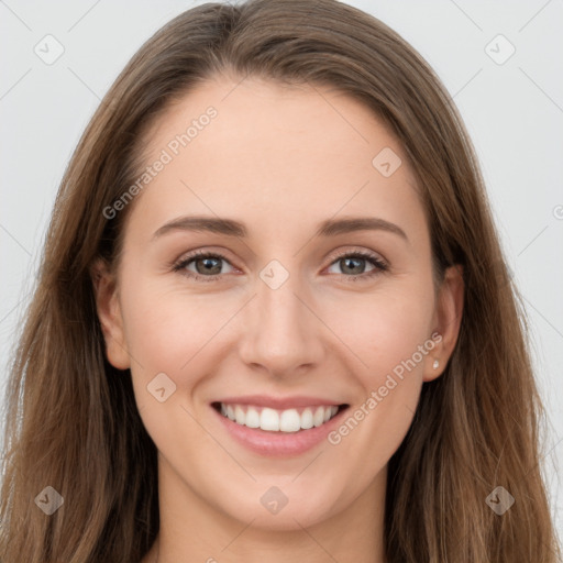 Joyful white young-adult female with long  brown hair and grey eyes