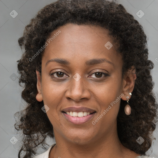 Joyful black young-adult female with medium  brown hair and brown eyes