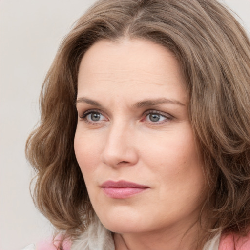 Neutral white young-adult female with medium  brown hair and grey eyes