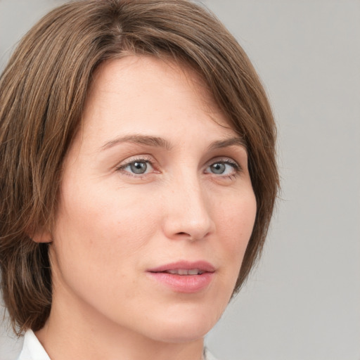 Neutral white young-adult female with medium  brown hair and grey eyes