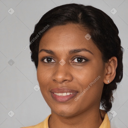 Joyful black young-adult female with medium  brown hair and brown eyes