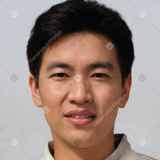 Joyful asian young-adult male with short  black hair and brown eyes