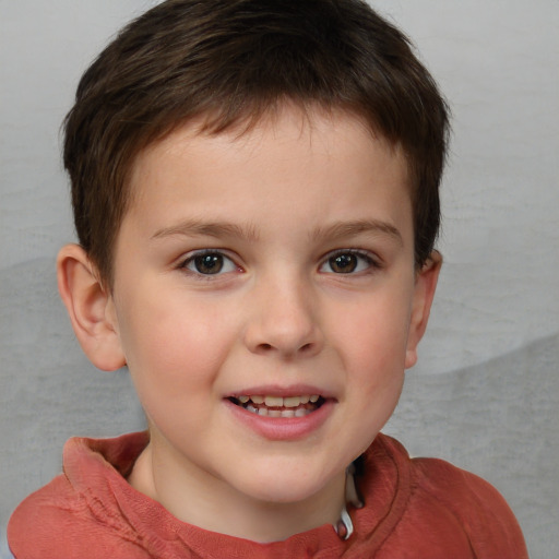 Joyful white child male with short  brown hair and brown eyes