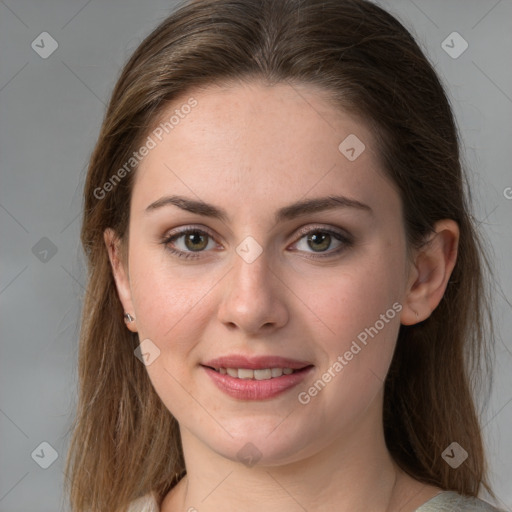 Joyful white young-adult female with medium  brown hair and green eyes