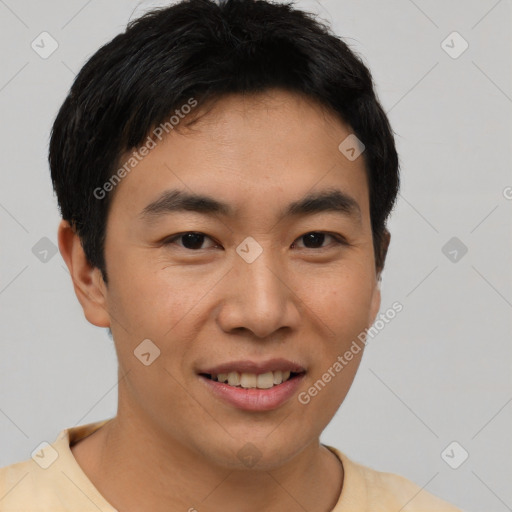 Joyful asian young-adult male with short  brown hair and brown eyes