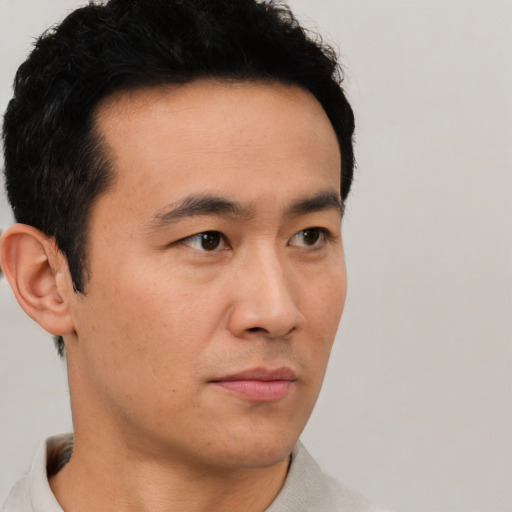 Neutral asian young-adult male with short  black hair and brown eyes