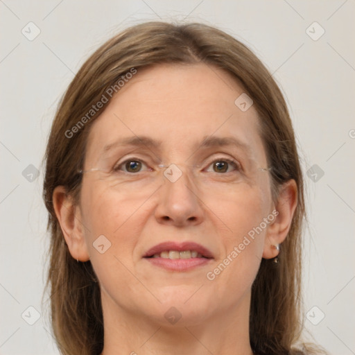 Joyful white adult female with medium  brown hair and grey eyes