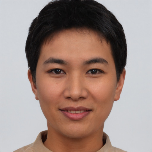 Joyful asian young-adult male with short  black hair and brown eyes