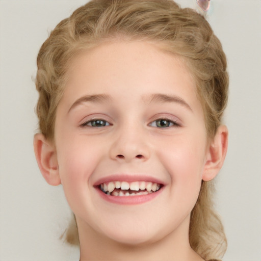 Joyful white child female with short  brown hair and green eyes