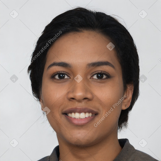 Joyful latino young-adult female with long  black hair and brown eyes