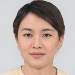 Joyful asian young-adult female with short  brown hair and brown eyes