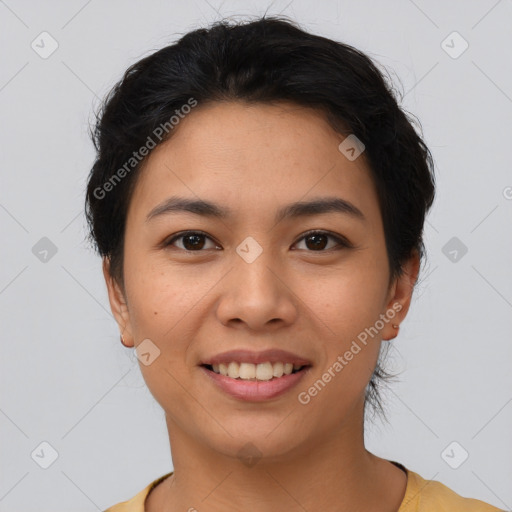 Joyful asian young-adult female with short  brown hair and brown eyes