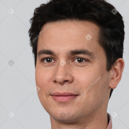 Joyful white adult male with short  brown hair and brown eyes