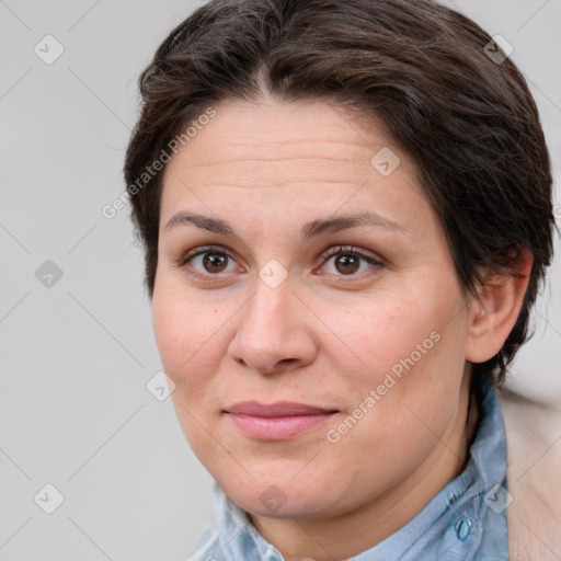 Joyful white adult female with medium  brown hair and brown eyes