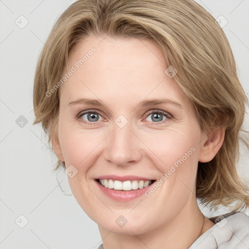 Joyful white young-adult female with medium  brown hair and blue eyes