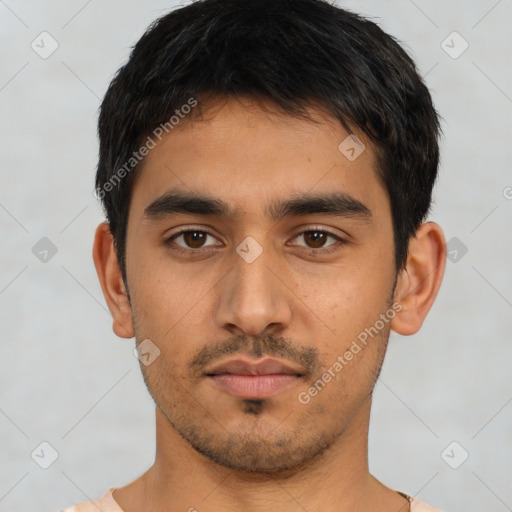 Neutral latino young-adult male with short  black hair and brown eyes