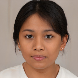 Neutral asian young-adult female with medium  brown hair and brown eyes