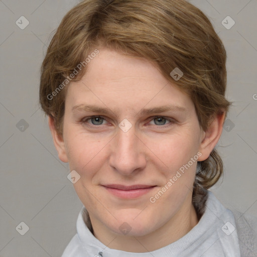 Joyful white young-adult female with medium  brown hair and blue eyes