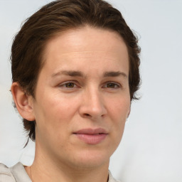 Joyful white adult female with short  brown hair and brown eyes