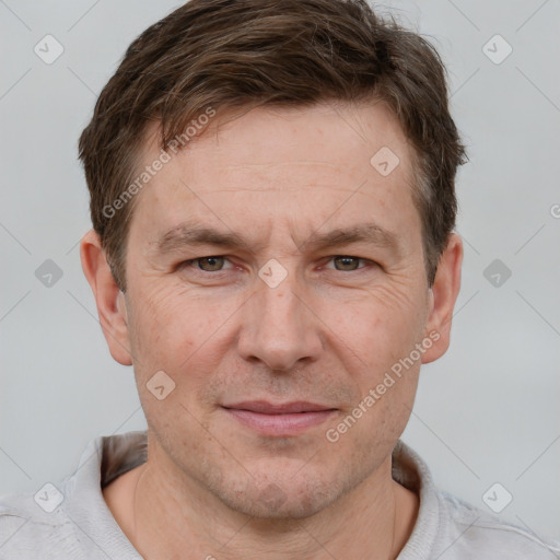 Joyful white adult male with short  brown hair and grey eyes