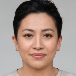 Joyful asian young-adult female with short  brown hair and brown eyes