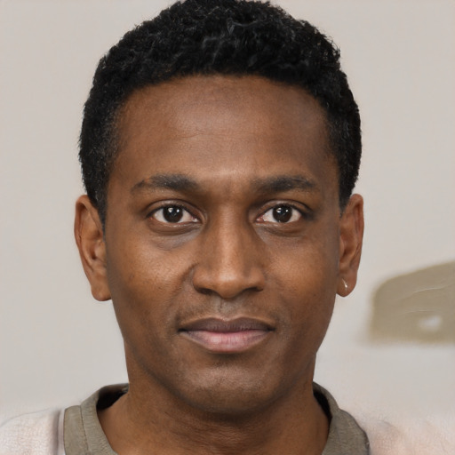 Neutral black young-adult male with short  black hair and brown eyes