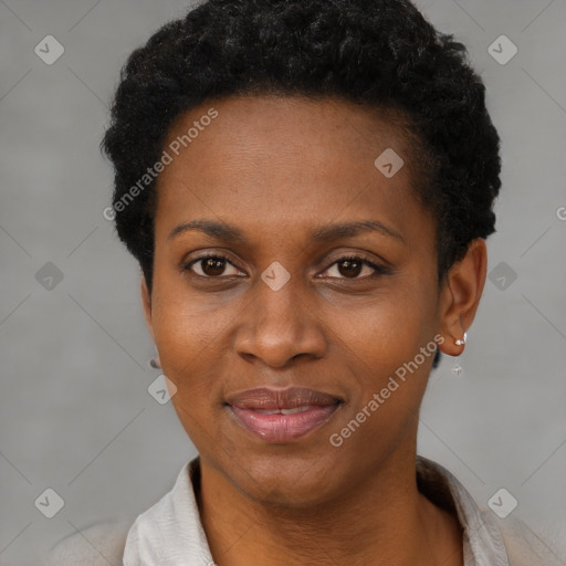 Joyful black adult female with short  black hair and brown eyes