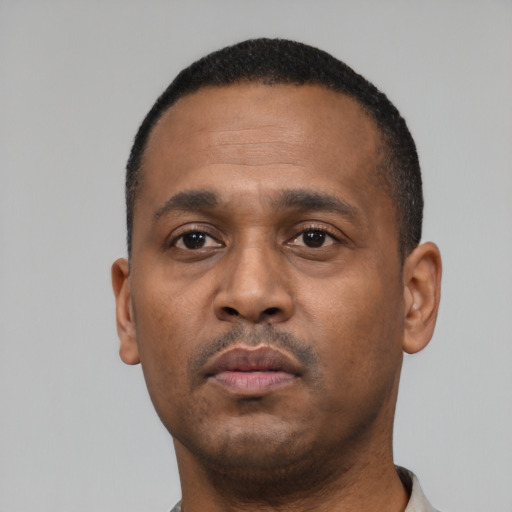Neutral black young-adult male with short  black hair and brown eyes