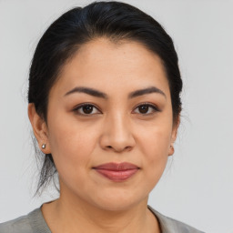 Joyful asian young-adult female with medium  brown hair and brown eyes