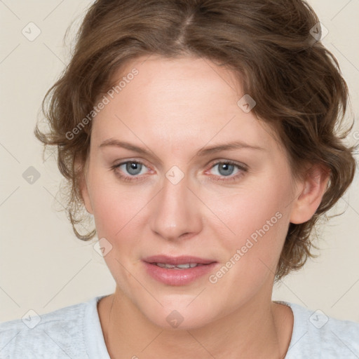 Joyful white young-adult female with medium  brown hair and blue eyes