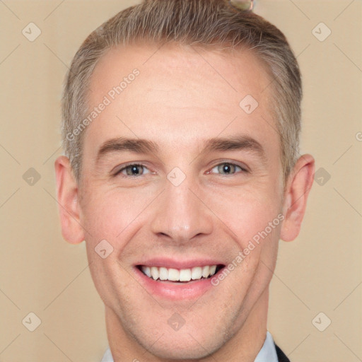 Joyful white adult male with short  brown hair and grey eyes