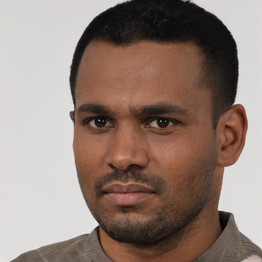 Neutral black young-adult male with short  black hair and brown eyes