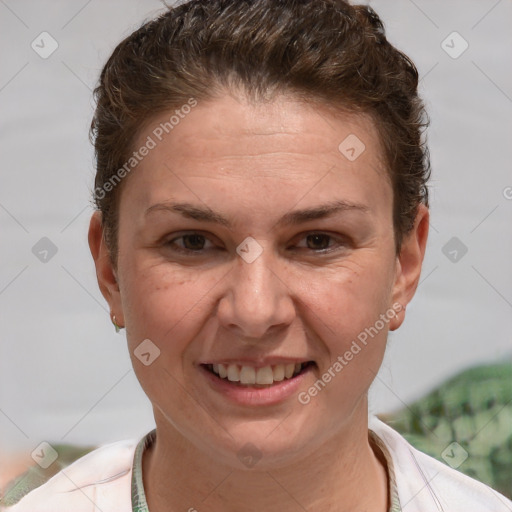 Joyful white adult female with short  brown hair and brown eyes