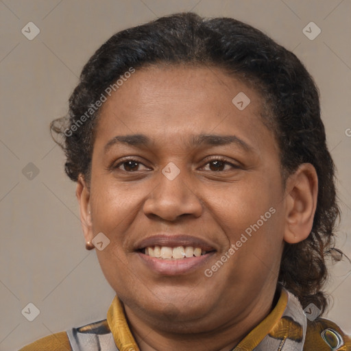 Joyful latino adult female with short  brown hair and brown eyes